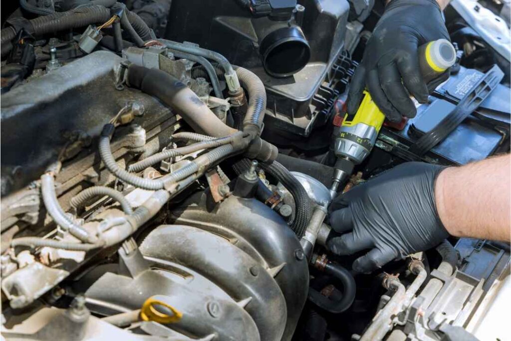 Car engine with labeled intake manifold showing cracks, gaskets, and airflow paths – visual guide to common intake manifold problems and solutions