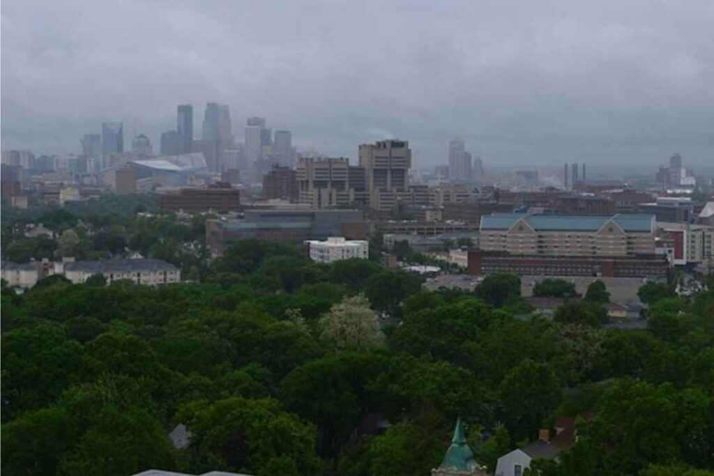 Minneapolis air quality warning Memorial Day 2025 — skyline obscured by wildfire smoke and haze, showing impact of poor AQI.