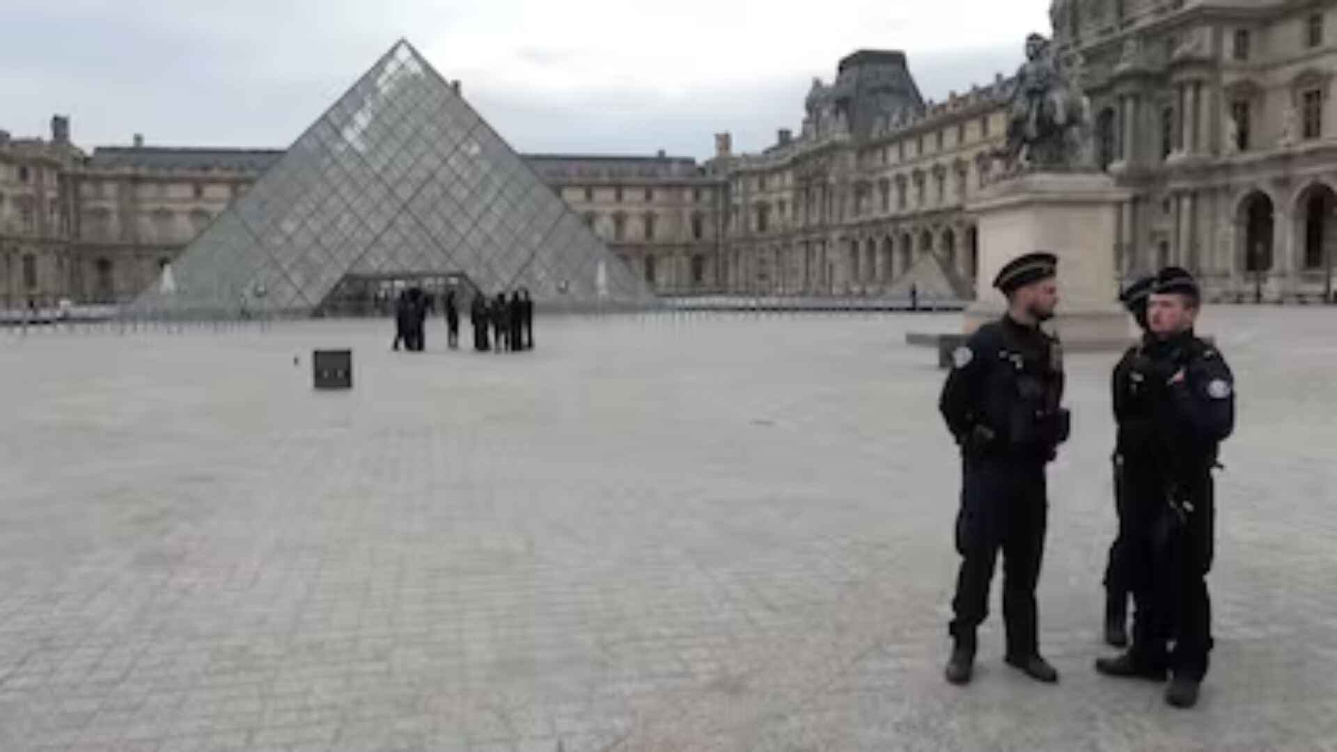 Police secure the louvre museum robbery courtyard in Paris after shocking louvre museum robber and jewel heist.